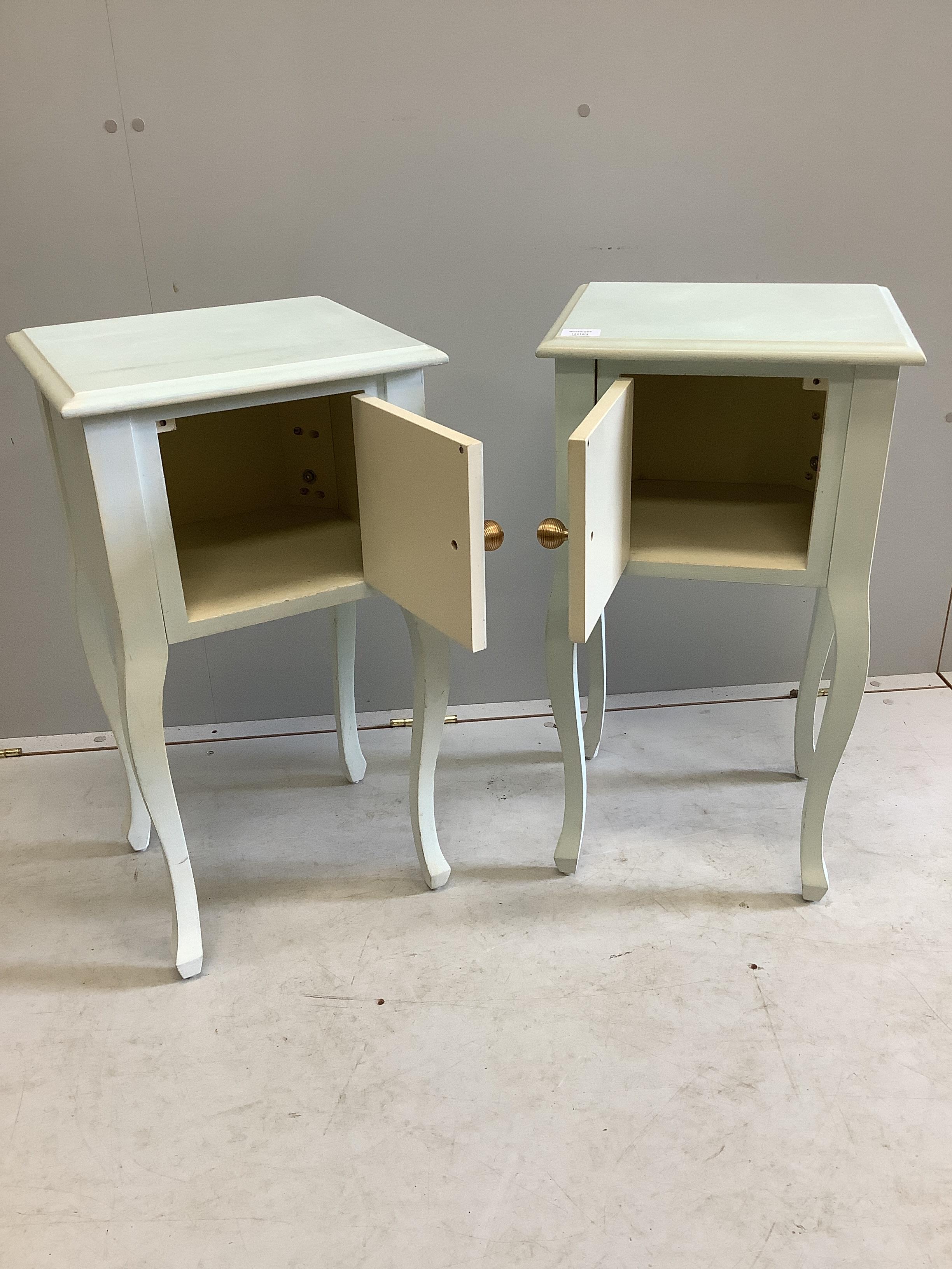 A pair of reproduction painted bedside cabinets, width 38cm, depth 34cm, height 71cm